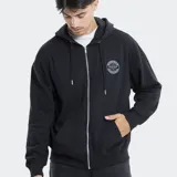 Campera con cierre frontal y capucha, color beige, con logo circular de la marca Reef estampado en el pecho y bolsillos tipo canguro.