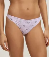 Pack de dos tangas de microfibra, una blanca lisa y otra lila con estampado de ojos y lunares.