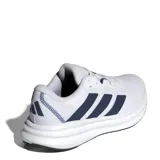 Championes de running Adidas Galaxy 7, color blanco con detalles en azul marino. Presentan un diseño de malla transpirable, cierre con cordones y suela con tecnología Cloudfoam para mayor amortiguación.