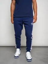 Pantalón de jogging azul marino de felpa con corte ajustado y banda lateral gris.