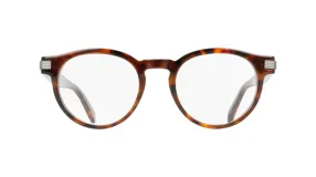 Lentes de receta con armazón de acetato en diseño carey, de forma redondeada y detalles metálicos en las bisagras.
