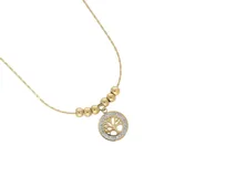 Collar dorado de acero con dije circular calado con diseño de árbol de la vida y borde con strass.
