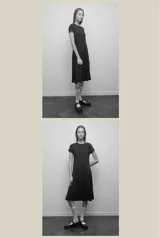 Vestido midi negro confeccionado en viscosa, de corte evasé, mangas cortas y escote redondo.