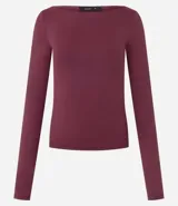 Blusa de manga larga confeccionada en poliamida y elastano, con ajuste regular y escote canoa. Diseño liso y minimalista.