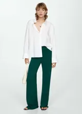 Pantalon wideleg de tejido de punto fino, con cintura elástica y diseño largo de corte fluido.