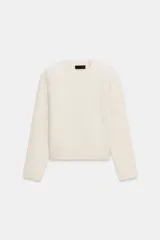 Jersey de punto de cuello redondo y manga larga con hombreras, de corte clásico y color crudo.