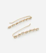 Par de caravanas ear cuff doradas con forma de flores y pedrería de strass.