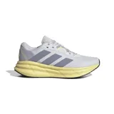 Championes Adidas Galaxy 6 de dama, color gris claro con detalles en lila y amarillo. Poseen las tres tiras características de la marca en color lila y suela gruesa de goma con tecnología Cloudfoam.