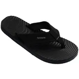 Ojotas Havaianas Surfer Coast, color negro, con tiras de tela texturizada y suela con diseño ondulado.