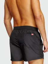 Short de baño negro Diesel, modelo Ken-37-D-Core, con logo estampado en blanco en la pierna izquierda.