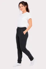Pantalón de jogging unisex de felpa, color verde oscuro, con cintura elástica con cordón de ajuste y puños elásticos en los tobillos.