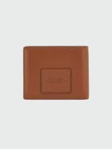 Billetera Marc Jacobs modelo The Billfold, color negro, con diseño plegable de cuero texturizado y estampado frontal en relieve con el texto "The Wallet" y la marca.