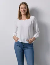 Blusa azul marino de gasa con escote en V y mangas largas con puño. Marca Sioni.