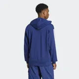 Canguro Adidas de felpa francesa color azul, con capucha y cordón ajustable, bolsillo canguro frontal y hombros caídos. Cuenta con las icónicas tres tiras blancas en las mangas y el logo de la marca bordado en el pecho.