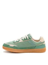 Championes Caterpillar modelo Pause Retro, de diseño urbano con combinación de lona y gamuza en tonos verde y beige. Presenta suela de goma color caramelo con textura hexagonal y logo de la marca en el lateral y la lengüeta.