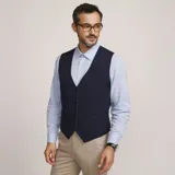 Chaleco reversible Due Volti de corte sastrero, con diseño a cuadros en tonos de gris y cierre frontal con cuatro botones oscuros.