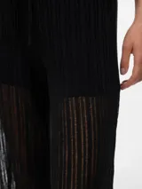 Pantalón negro de punto single jersey con corte wide leg, tiro alto y cintura elástica con cordón ajustable.