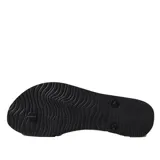 Ojotas negras Reef Seaside con plantilla texturizada y tiras finas con diseño trenzado.