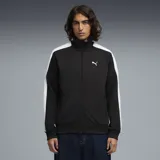Campera deportiva Puma modelo ESS T7, color negro con franjas blancas en las mangas. Presenta cuello alto, cierre frontal completo y logo de la marca bordado en el pecho.