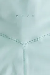 Leggings de yoga acampanados de tiro alto en color verde menta, confeccionados en tejido funcional con detalle de torsión en la cintura.