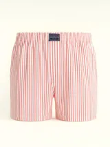 Bóxer de algodón blanco con estampado de flores pequeñas color celeste, con cintura elástica y logo de la marca en el centro.