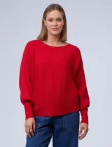 Buzo marca Cupio de tejido acanalado color azul. Tiene mangas largas estilo dolman y aplique de botones en la espalda.