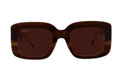 Lentes de sol Lancel con armazón cuadrado de acetato en tono marrón carey y cristales oscuros a juego. Presentan el logo de la marca grabado en la esquina superior del cristal izquierdo.