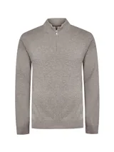 Sweater gris de punto con medio cierre y cuello alto, confeccionado en lana merino extrafina, de manga larga con puños y dobladillo en rib.