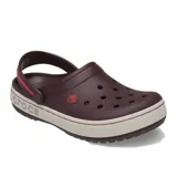 Zueco Crocs modelo Crocband Heritage, color negro con banda lateral en tono crema. Presenta correa de talón pivotante bicolor y diseño con textura pronunciada en la suela.