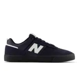 Championes New Balance Numeric 306, color azul marino con detalles en blanco y negro. Confeccionados en gamuza y material sintético, con el logo "N" en blanco en los laterales y suela de goma negra.