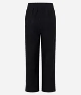 Pantalón de tricot negro con corte wide leg, transparencia delicada y bordado abstracto en relieve. Cuenta con cintura elástica y caída fluida.
