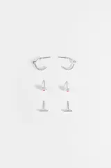 Set de tres aros plateados que incluye un par de argollas texturizadas, un par de abridores circulares con centro de color y un par de aros tipo barra recta.