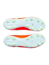 Championes de fútbol Under Armour Magnetico Select 4 FG, color naranja vibrante con detalles en gris claro y verde lima. Presentan una parte superior de piel sintética con estampado 3D para mayor control, cuello textil tipo calcetín y suela de TPU con tacos cónicos.