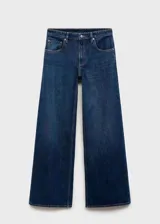 Jeans Annie de tiro bajo y diseño wide leg con perneras anchas, confeccionados en tejido denim de algodón en color azul oscuro. Cuenta con cinco bolsillos, trabillas para cinturón y cierre frontal con botón y cremallera.