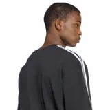 Remera Adidas de corte holgado, color negro, con cuello redondo y mangas cortas. Presenta las icónicas tres tiras blancas en los hombros y mangas, y el logo del trifolio bordado en el pecho.