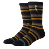Medias Stance Slipping Crew a rayas horizontales en tonos negro, marrón y ocre.