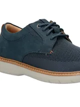 Zapato de estilo casual Hush Puppies, modelo Bangu, con diseño híbrido que combina cuero nobuck en el talón y laterales con tejido técnico transpirable en la parte frontal. Cuenta con cordones, suela de EVA flexible y costuras decorativas en el borde de la suela.