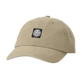 Gorro de visera curva Rip Curl modelo Premium Surf, color beige, con parche rectangular negro con logo bordado en el frente.