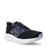 Championes de running New Balance modelo 460, color negro con detalles en violeta. Presentan exterior de malla transpirable con refuerzos sintéticos, cierre con cordones y entresuela amortiguada de color blanco.
