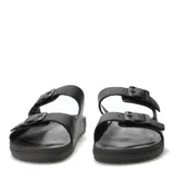 Sandalias de hombre con diseño de doble tira ajustable mediante hebillas metálicas negras. Presentan una base ergonómica y texturizada en color marrón oscuro.