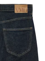 Jeans de tiro alto con corte wide leg en color azul oscuro, con costuras contrastantes y diseño clásico de cinco bolsillos.
