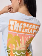 Remera blanca de algodón con estampado frontal y trasero con la leyenda "Rusty Australia Mermaid Beach". Corte holgado.