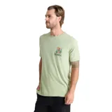 Remera verde claro de manga corta con cuello redondo, confeccionada en 100% algodón. Presenta un pequeño estampado gráfico en el pecho con diseño de cactus y la inscripción de la marca Roark.
