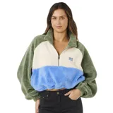 Buzo de polar con diseño color block en tonos verde, crema y azul. Presenta cuello alto con cierre frontal parcial, mangas largas holgadas y un pequeño parche bordado en el pecho.