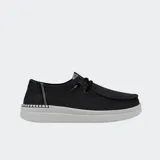 Zapatos Hey Dude modelo Wendy Rise, de lona color negro con detalles brillantes, suela de plataforma blanca y cordones elásticos.