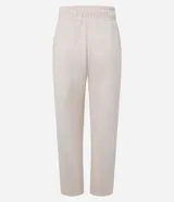 Pantalón zanahoria color crema, con cintura elástica, lazo, bolsillos laterales y superficie texturizada.