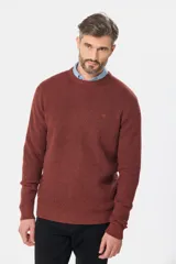 Buzo tejido de punto con escote redondo y textura estructurada. Diseño de manga larga con calce clásico.