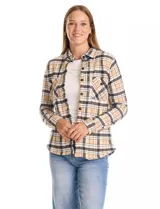 Sobrecamisa de tejido soft con estampado de cuadros en tonos beige, negro y blanco. Presenta cuello con solapa, cierre frontal con botones, mangas largas con puños abotonados y bolsillos aplicados en el pecho.