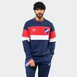 Buzo de felpa Umbro del Club Nacional de Football, con diseño de bloques de color en azul, rojo y blanco. Presenta cuello redondo, puños y ruedo acanalados, con el logo de la marca y el escudo del club bordados en el pecho.