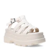 Sandalias tipo franciscanas con plataforma robusta y suela tractorada. Presentan un diseño de tiras entrecruzadas y cierre con hebilla metálica ajustable en el tobillo.